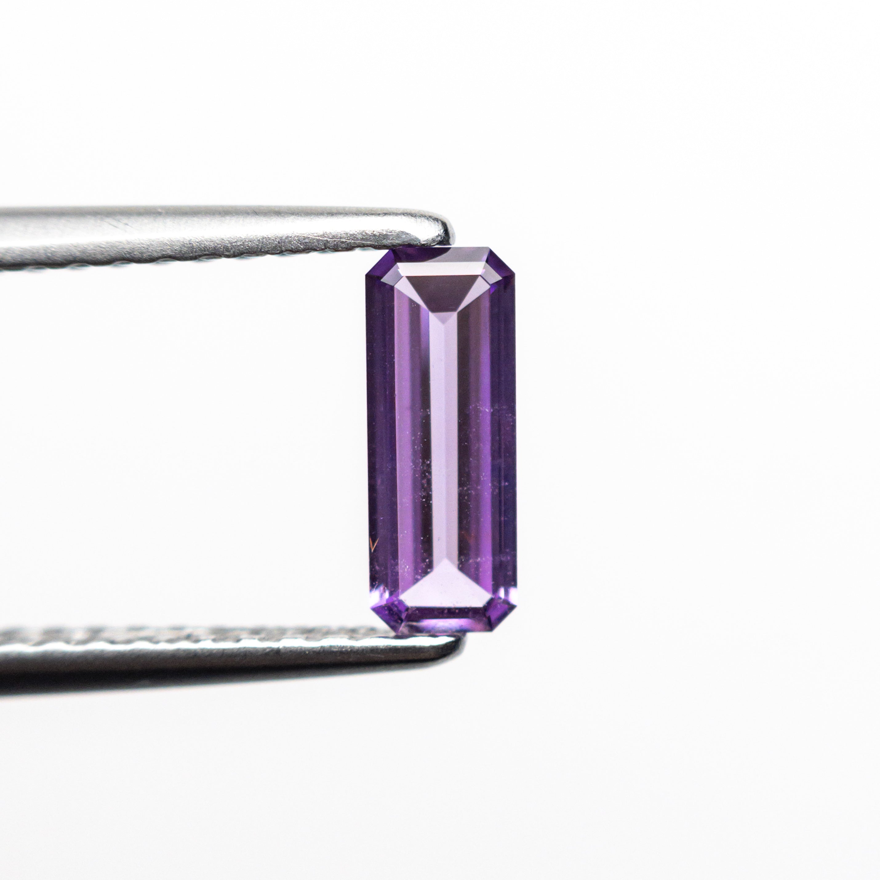 Elongated step - cut Violet Sapphire - 12th HOUSE