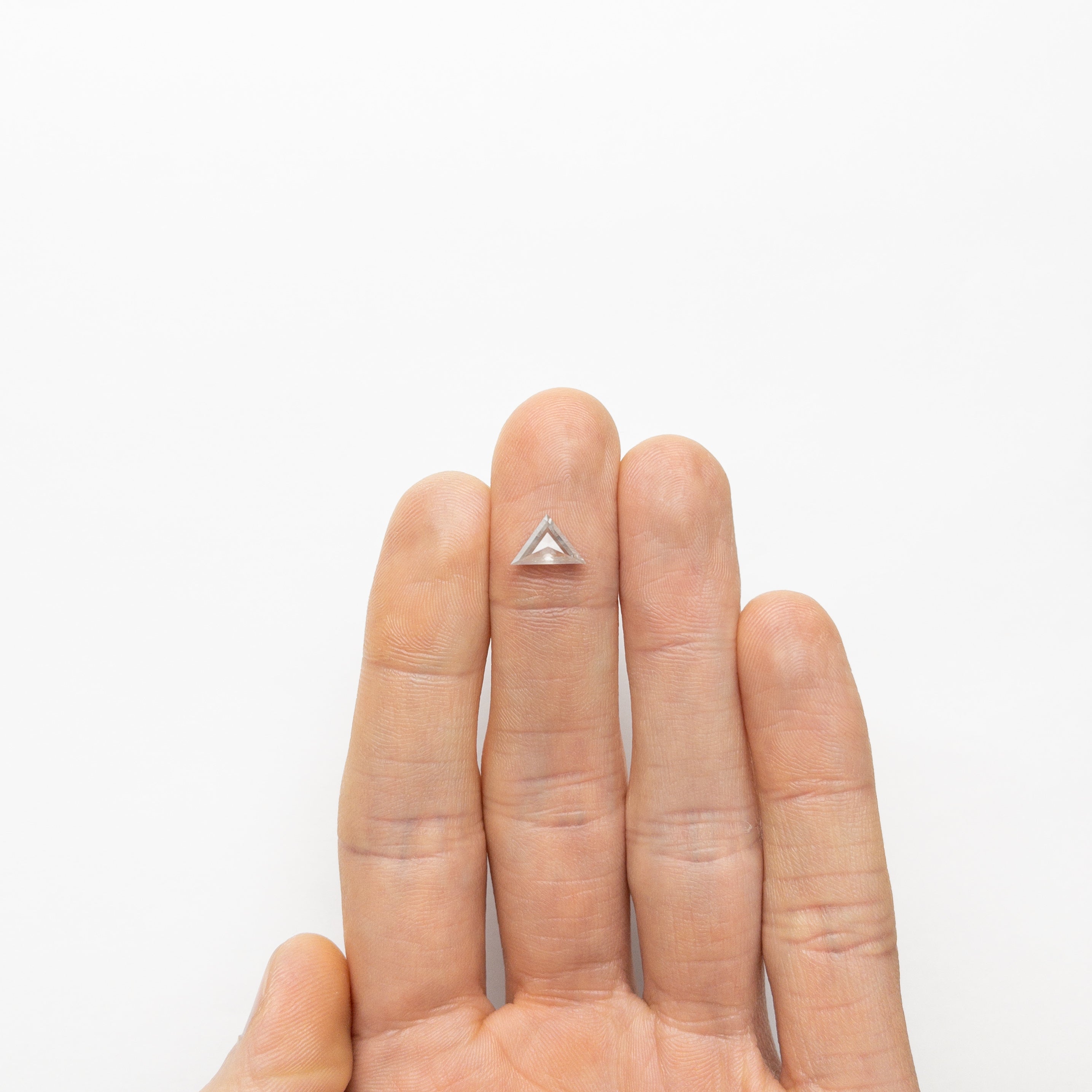 Fine line diamond tattoo on the finger