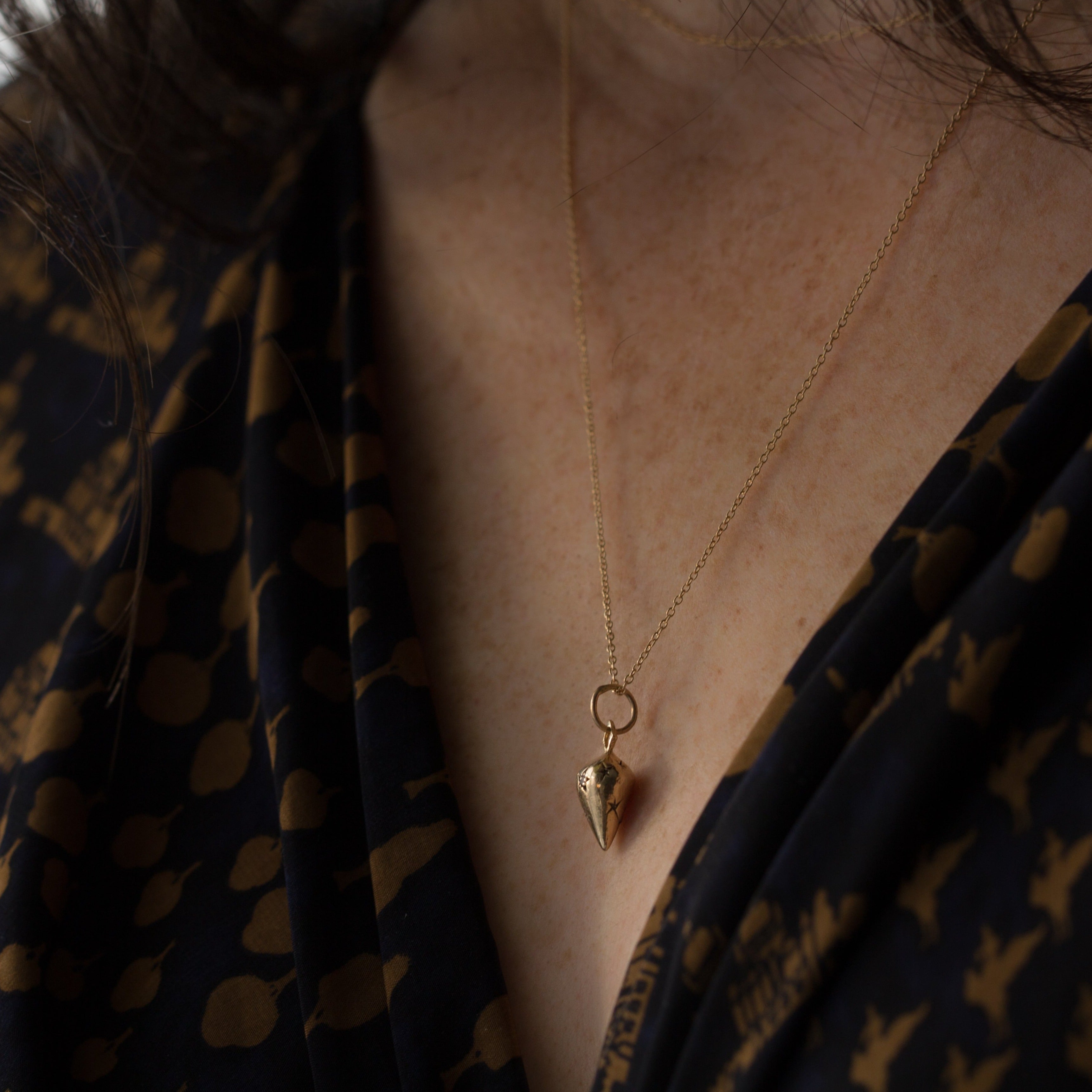pendulum necklace, pendulum and stars necklace, solid gold necklace, holiday gift ideas for her, 12th house jewelry, ceremonial and celestial jewelry, wear with love, kelly star lannen, ethically sourced gemstones, black diamonds necklace, connect to your subconscious